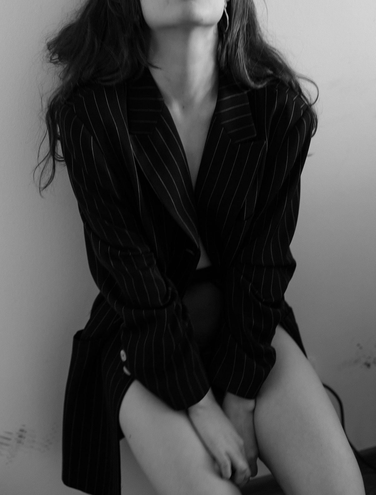 Woman in Black and White Striped Blazer